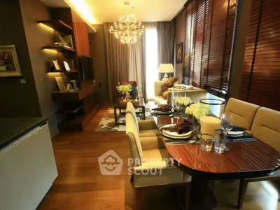 Luxurious living room with elegant dining area and modern lighting in a stylish apartment.
