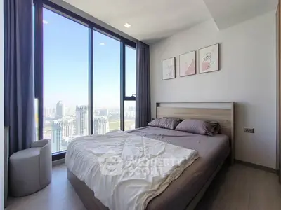 Modern bedroom with stunning city view and stylish decor