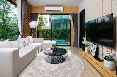 Luxurious modern living room with pool view and elegant decor