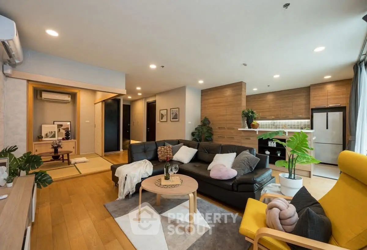 Spacious modern living room with open kitchen and stylish decor