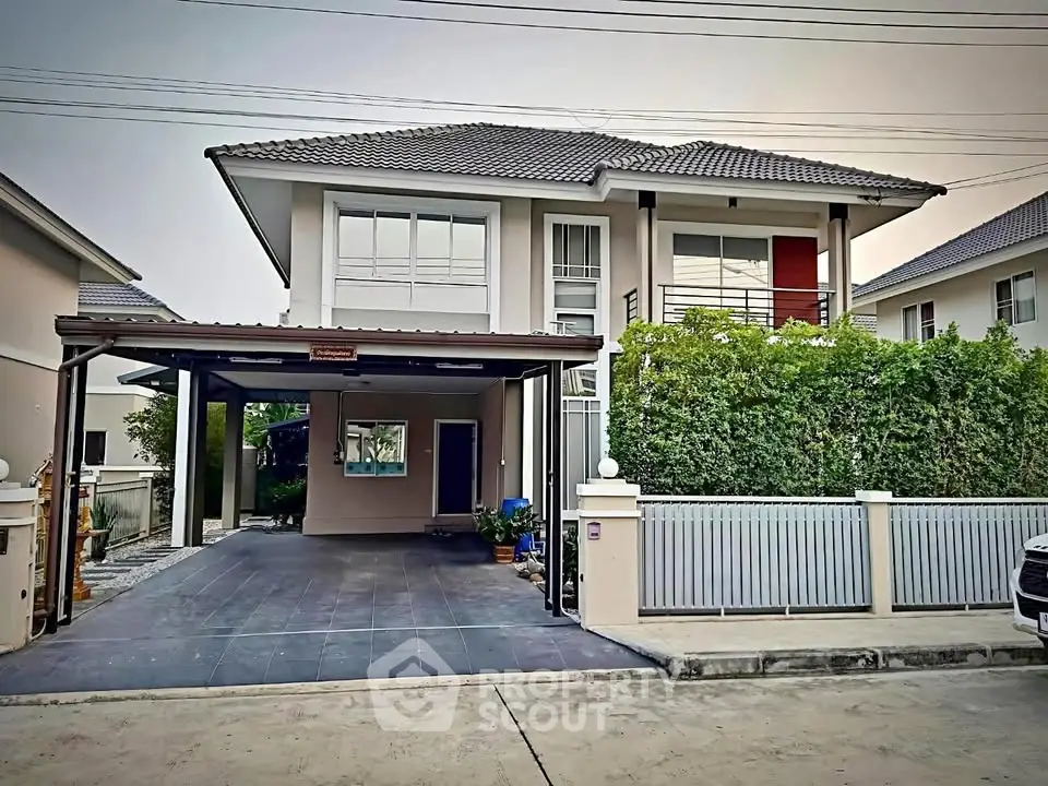 Charming two-story house with modern design and spacious driveway in a serene neighborhood.
