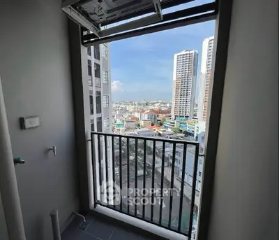 Stunning high-rise balcony view with cityscape and modern architecture.