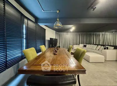 Spacious modern living room with elegant dining area and cozy seating