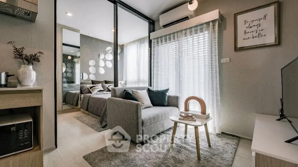 Modern living room with cozy seating and stylish decor in a contemporary apartment.