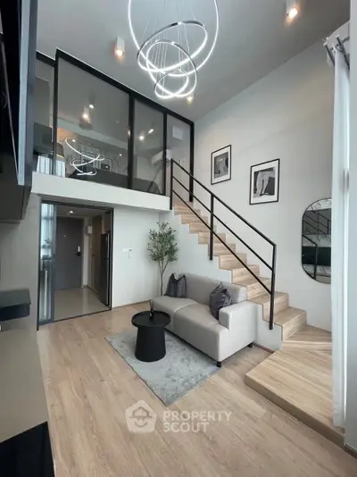 Modern duplex living room with stylish decor and elegant staircase