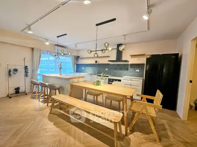 Spacious modern kitchen with open layout and stylish lighting