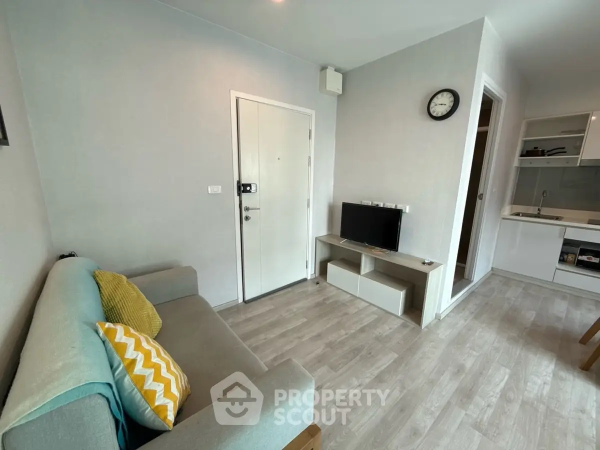 Modern living room with stylish decor and open kitchen layout