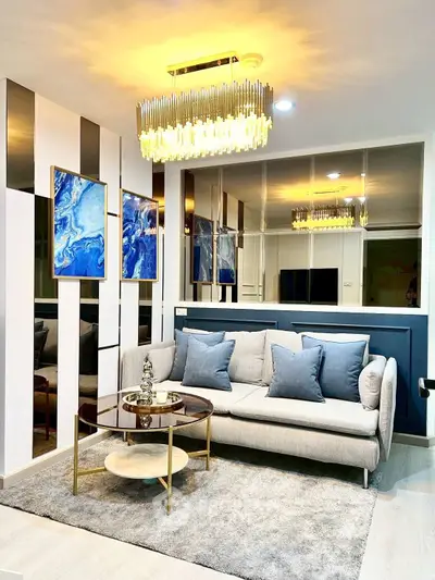 Luxurious modern living room with elegant chandelier and stylish decor