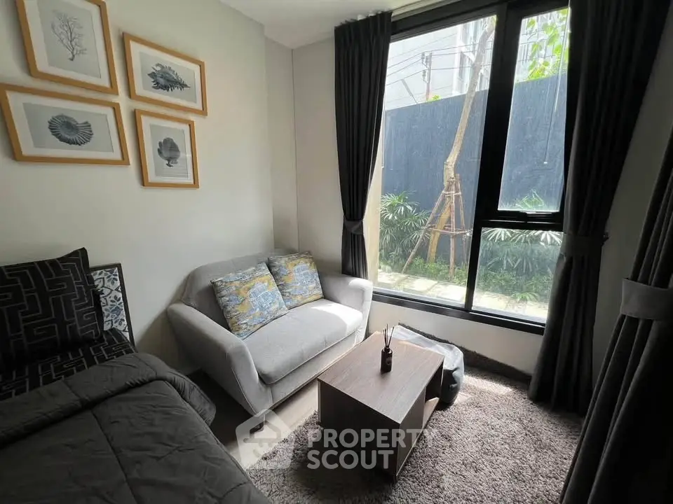 Cozy living room with modern decor and large window view