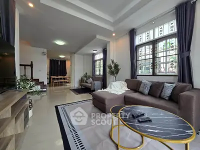 Spacious modern living room with stylish decor and natural light