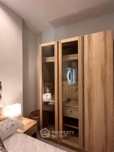 Cozy bedroom with modern wooden wardrobe and ambient lighting