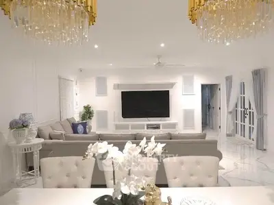 Luxurious living room with elegant chandeliers and modern decor