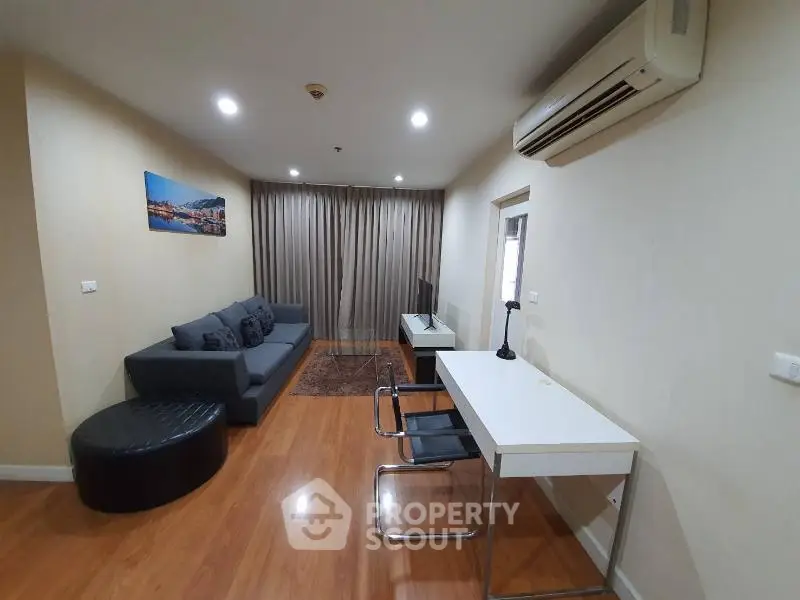 Modern living room with stylish furniture and air conditioning in a cozy apartment.