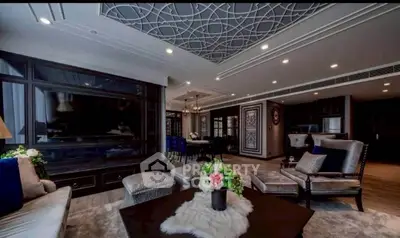 Luxurious living room with elegant ceiling design and modern furnishings, perfect for upscale living.