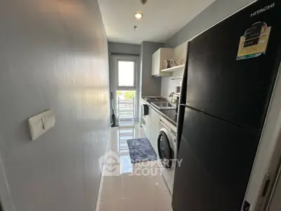 Modern kitchen with sleek appliances and bright natural light