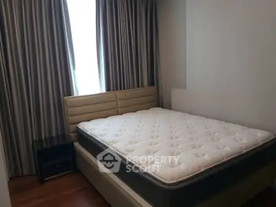 Cozy bedroom with modern bed and elegant curtains