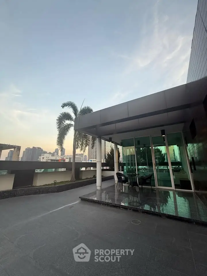 Stunning rooftop terrace with city skyline views and modern outdoor seating area.