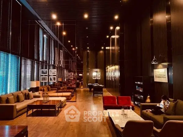 Luxurious and spacious living room with elegant lighting and modern decor.