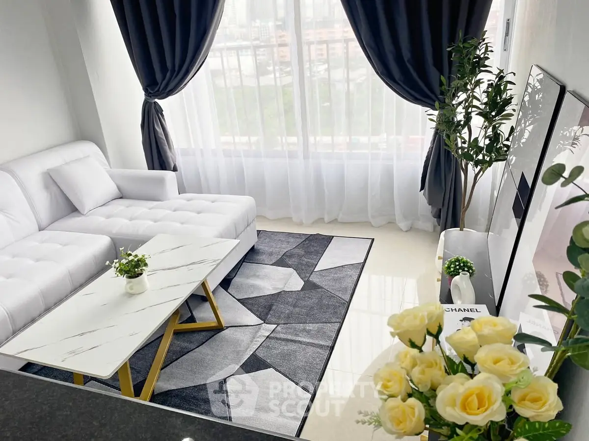 Elegant living room with modern decor and large window view