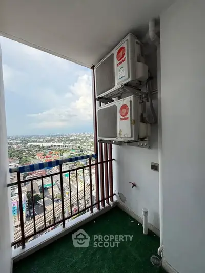 High-rise balcony with air conditioning units and stunning city view