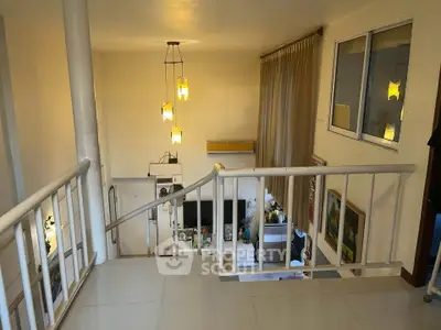Spacious modern living area with stylish lighting and open layout