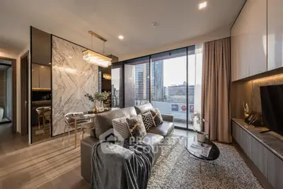 Luxurious modern living room with city view, elegant decor, and open layout in high-rise apartment.