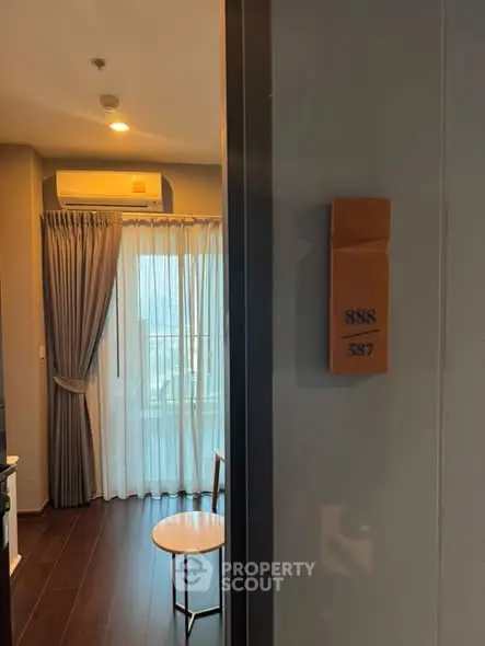 Modern apartment interior with air conditioning and balcony view