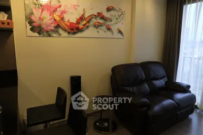 Cozy living room with leather sofa and vibrant koi fish artwork, featuring floor-to-ceiling windows.