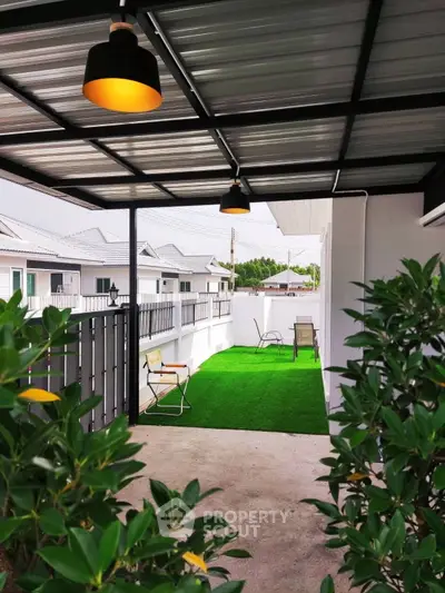 Charming house with lush garden and inviting entrance, perfect for family living.