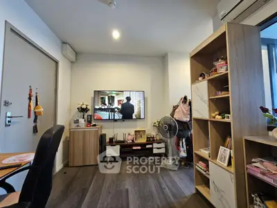 Cozy living room with modern decor and wall-mounted TV