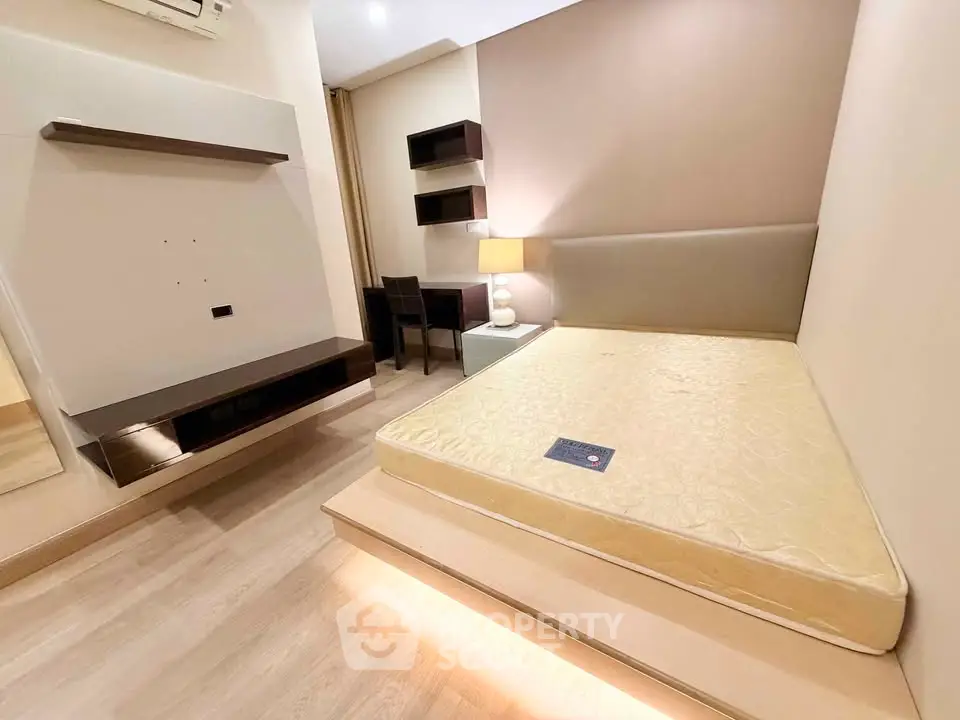 Modern minimalist bedroom with built-in shelves and cozy lighting