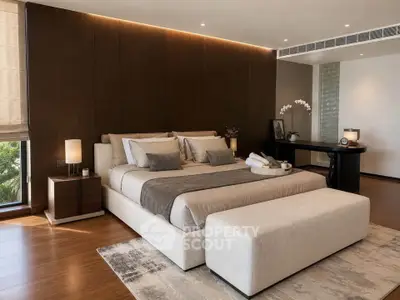 Luxurious bedroom with elegant decor and modern furnishings, featuring a king-sized bed and ambient lighting.