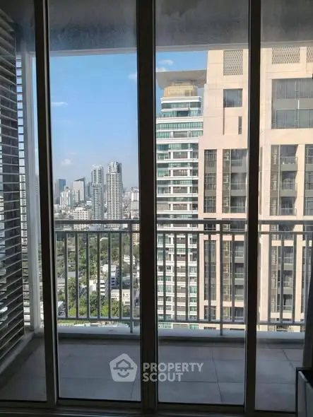 Stunning cityscape view from a modern high-rise balcony, perfect for urban living enthusiasts.