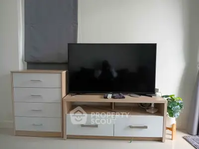 Modern living room with sleek TV stand and storage drawers, perfect for stylish home entertainment setup.