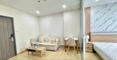 Modern studio apartment with cozy living area and stylish bedroom