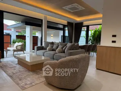Luxurious modern living room with stylish furniture and open layout, perfect for relaxation and entertaining.