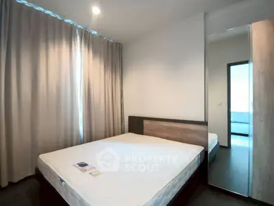 Modern bedroom with large window and minimalist decor