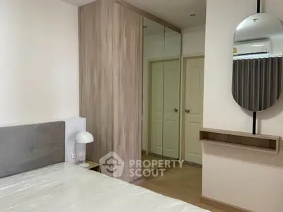 Modern bedroom with mirrored wardrobe and stylish decor