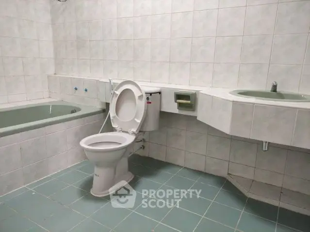 Spacious bathroom with bathtub and modern fixtures