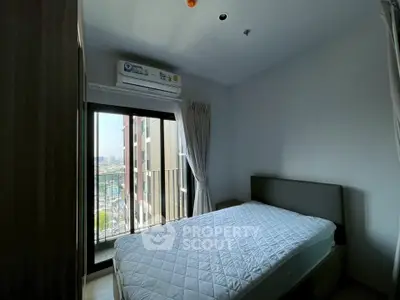 Cozy bedroom with balcony view in modern apartment
