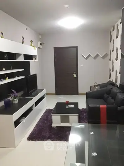 Modern living room with sleek furniture and stylish decor, perfect for urban living.