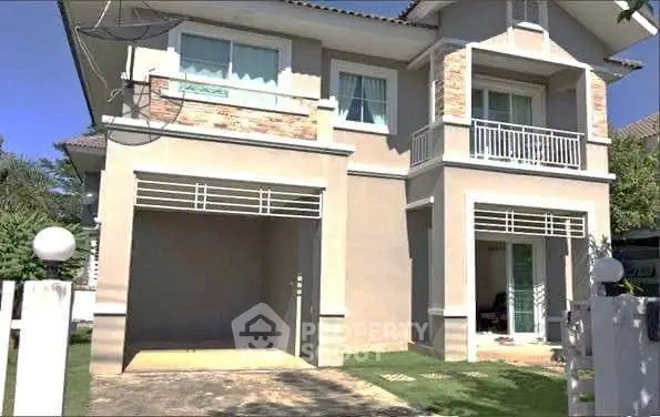 Charming two-story house with modern design and spacious balcony in a serene neighborhood.