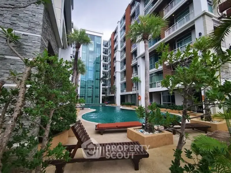 Luxurious apartment complex with pool and lush greenery, perfect for modern living.