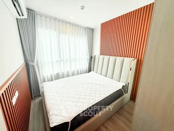 Modern bedroom with stylish wood paneling and large window