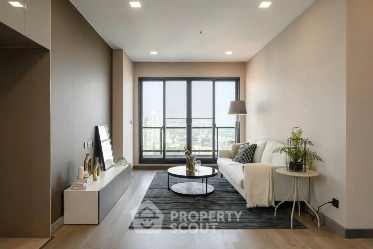 Modern living room with large windows and city view, stylish decor and cozy ambiance.