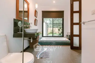 Luxurious bathroom with garden view and modern fixtures