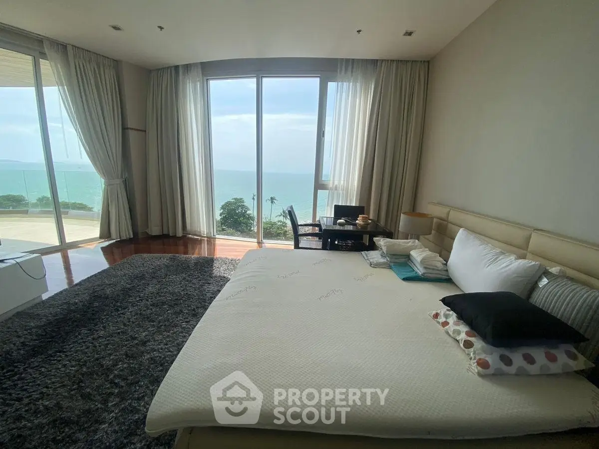 Luxurious bedroom with stunning ocean view and elegant decor