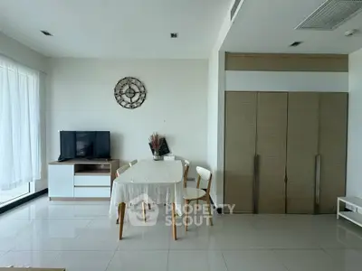 Modern living room with sleek furniture and natural light, perfect for cozy gatherings.