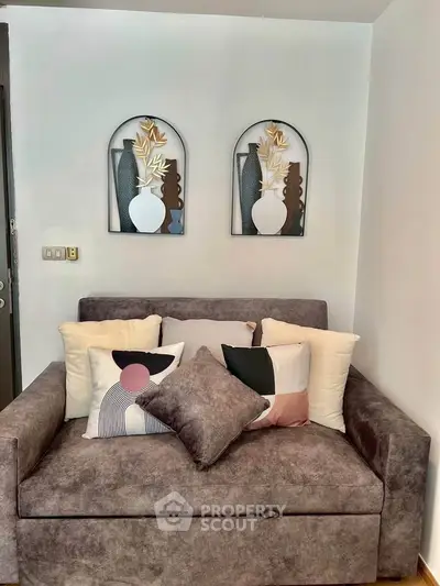 Cozy living room with stylish sofa and modern wall art decor