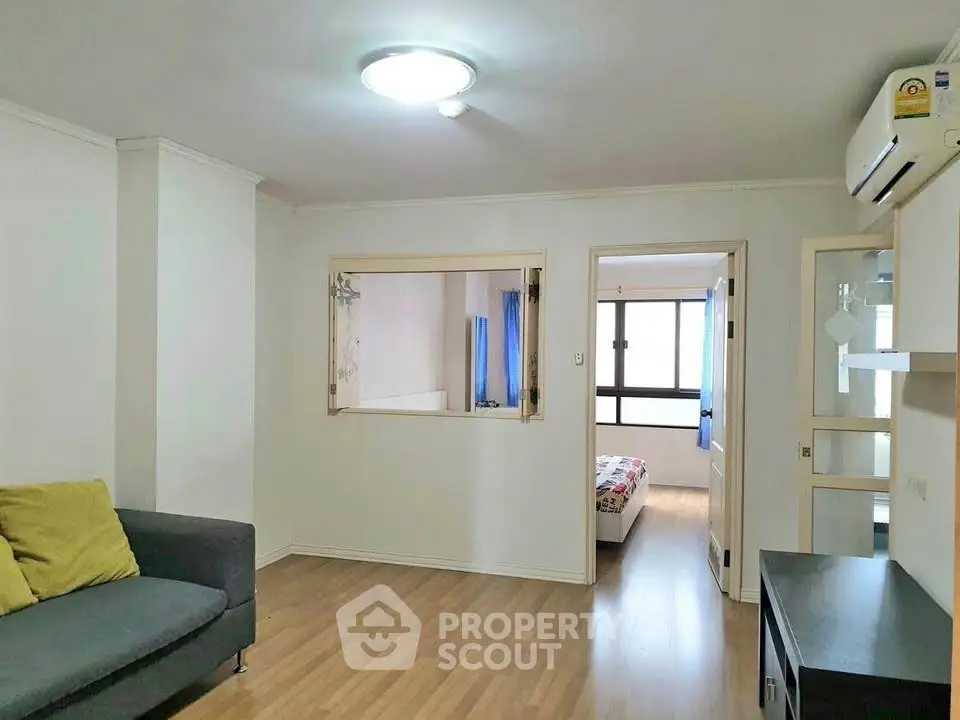 Spacious living room with wooden flooring and modern decor